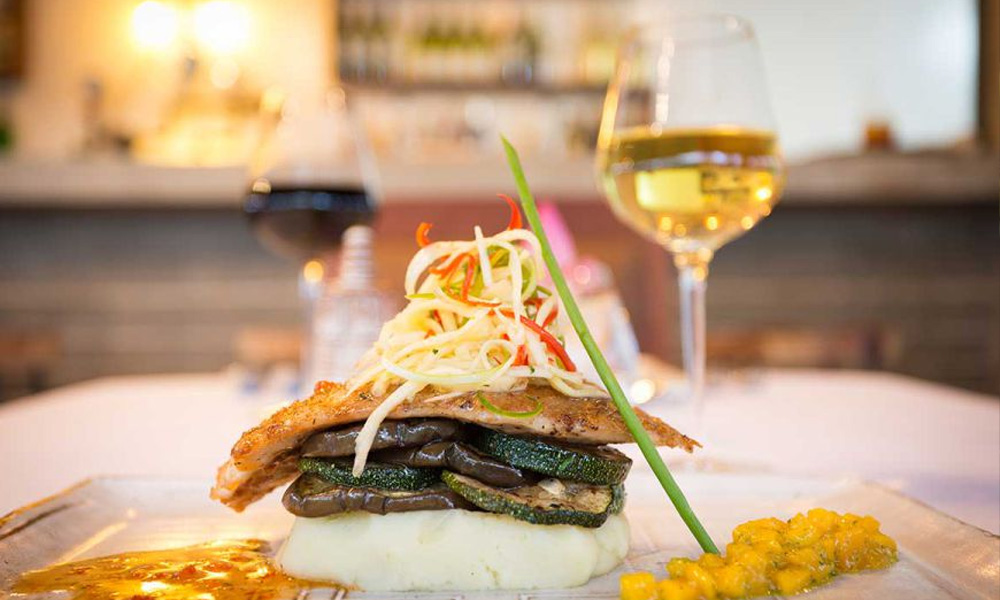 Gourmet grilled fish fillet served with mashed potatoes and sautéed vegetables at Shintana Saya Residence.