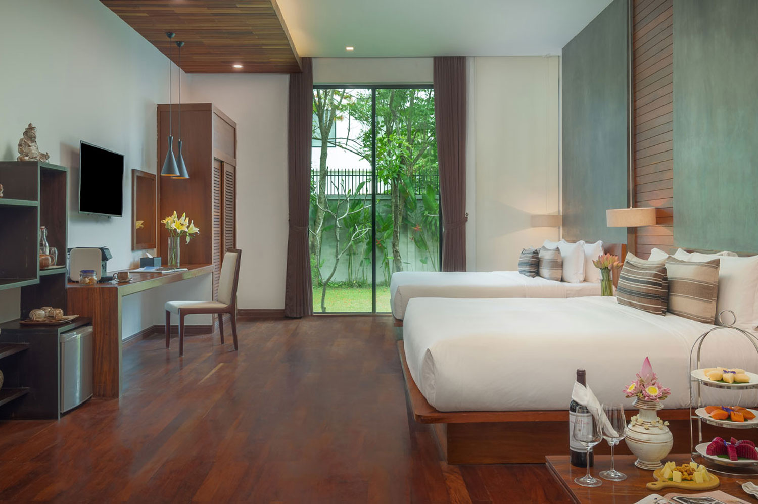 Luxury twin bedroom with garden view at Shintana Saya Residence, Siem Reap.