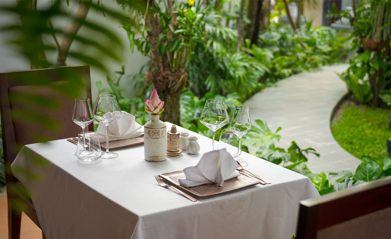 Outdoor dining table setup at Shintana Saya Residence restaurant Siem Reap