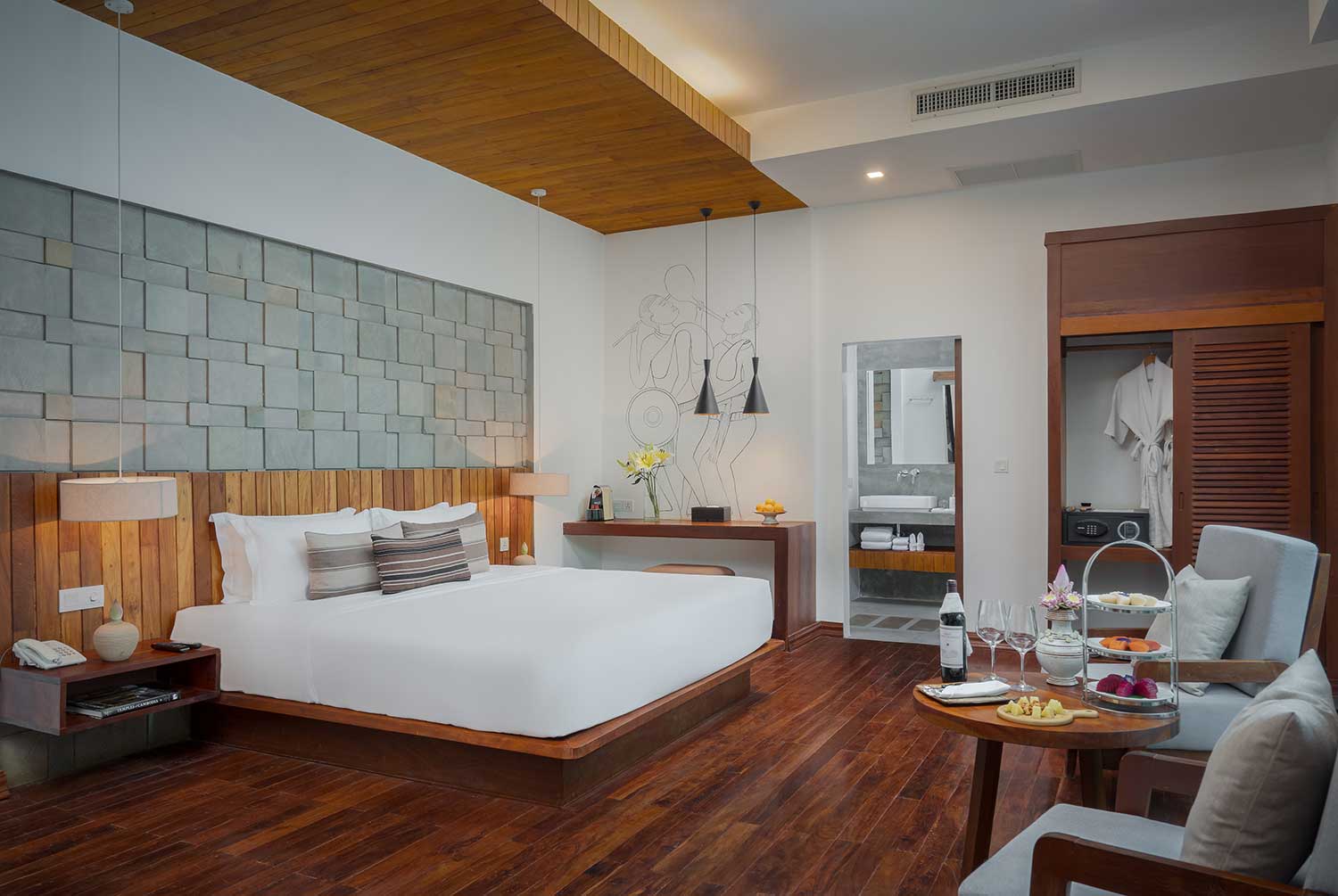 Spacious Premium Room at Shintana Saya Residence with king bed and hardwood floors.