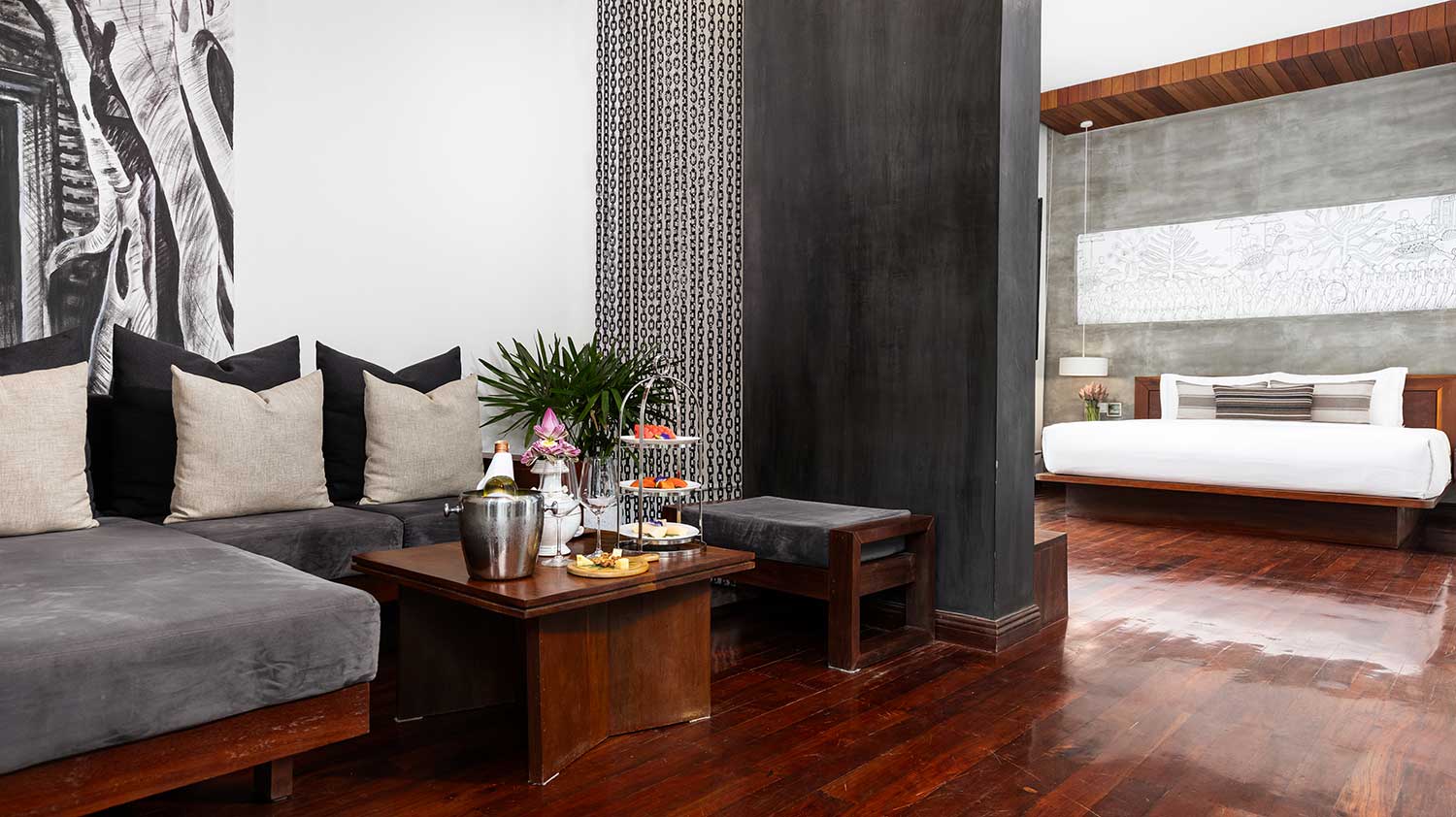 Spacious open-plan Royal Suite at Shintana Saya Residence Siem Reap featuring a living lounge and king bedroom.