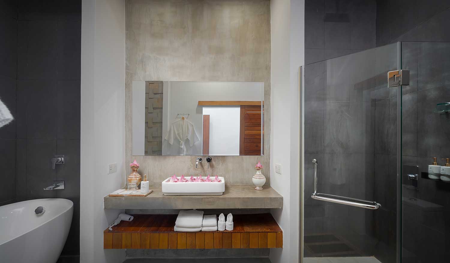 Modern en-suite bathroom with a double vanity and minimalist wooden storage in Royal Suite room.