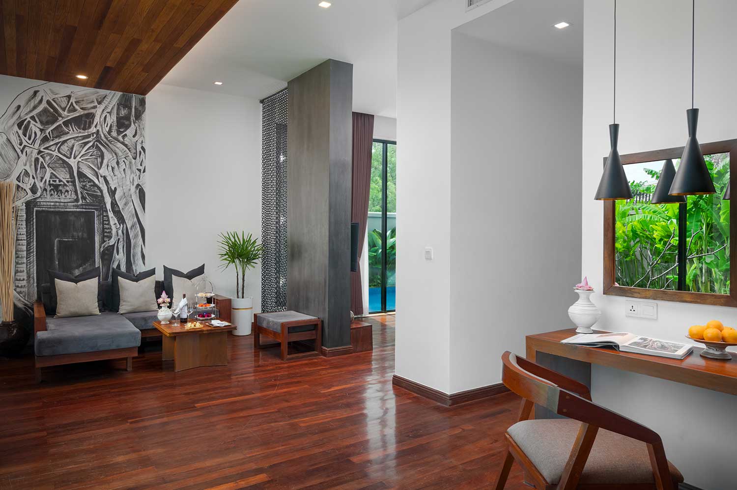 Living lounge and dedicated workspace in the Royal Two-Bedroom Family Suite at Shintana Saya Residence Siem Reap.