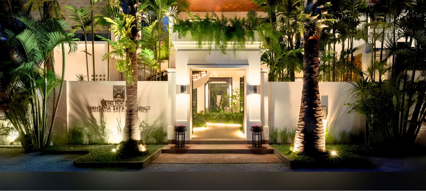 Illuminated entrance of Shintana Saya Residence boutique hotel at night in Siem Reap, Cambodia.